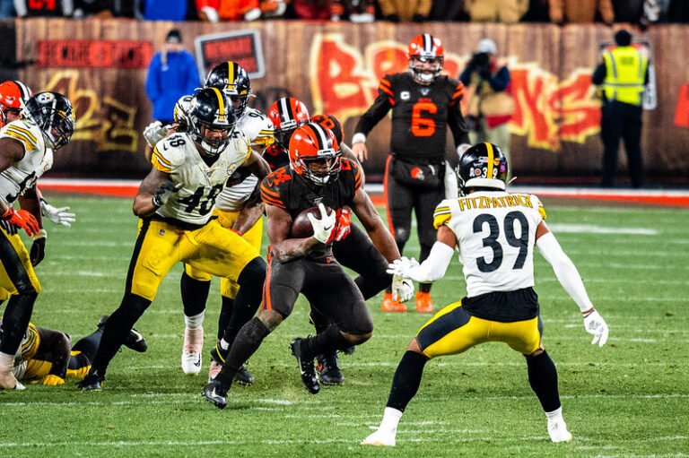 Nick Chubb running the ball and being tackled vs, Pittsburgh Steelers